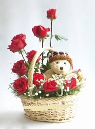 6 inches Teddy with 9 Red roses in same basket