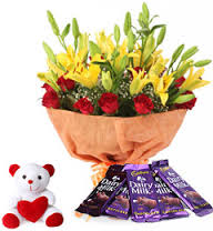 Red roses with Yellow Lilies in a bouquet and 6 inches Teddy and 5 Silk chocolates