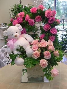 24 pink roses with Teddy arranged in the same basket