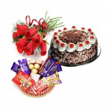 6 Red roses bouquet with 1/2 Kg black forest cake and small chocolate basket