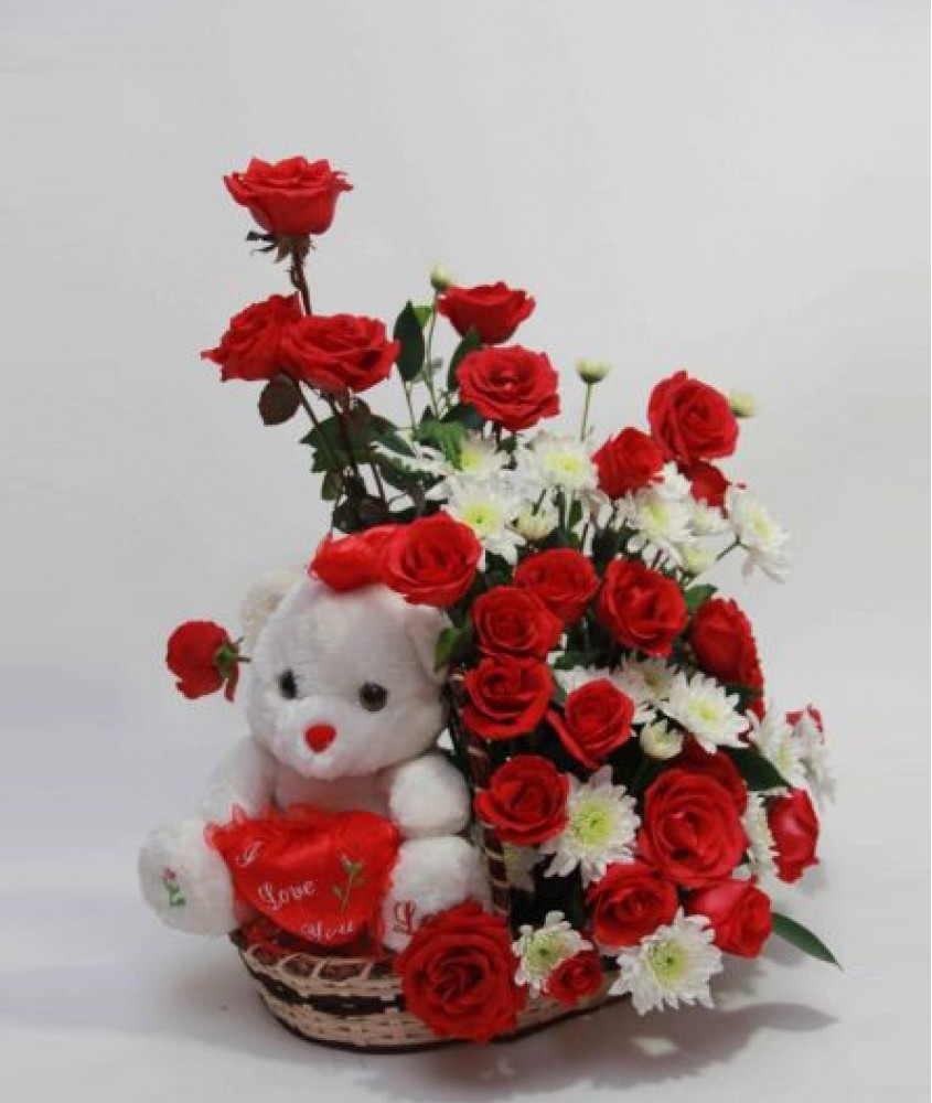 Teddy( 6 inches) in the same Basket with 18 Red Roses and 6 white Gerberas
