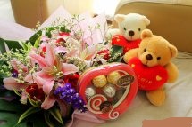 2 Teddy bears 6 inches each and pink Lilies in same basket with small heart chocolate box