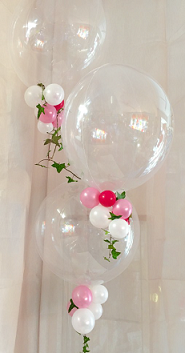 3 Clear Bubble balloons with tiny white red and pink balloons tied to the stems of the the balloons