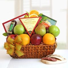 Fruit basket with cheese, chocolates, nuts, crackers