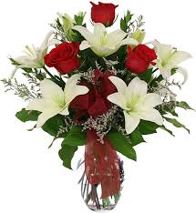 3 white Liliums 6 Red roses in Vase