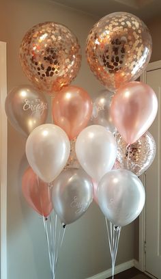 20 Rose gold helium gas inflated birthday balloons tied with ribbons