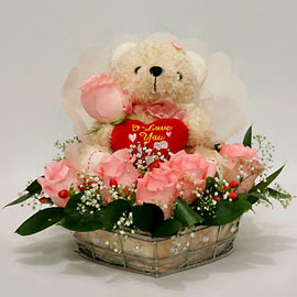 Teddy (6 inches) surrounded with 6 pink Roses