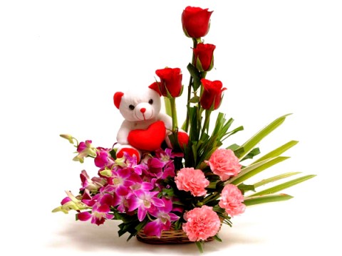 4 Red Roses 4 Orchids 4 Pink carnations basket and teddy(6 inches)
