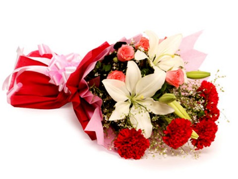 White lilies with red carnations in a bouquet