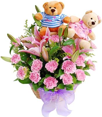 2 Teddies sitting in Basket with 18 pink carnations