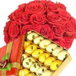 1 Kg Sweets and 12 Roses Basket