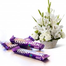 3 Dairy Milk chocolates and basket of 6 white gladiolli 6 white carnations