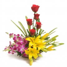 4 Purple Orchids 2 Yellow lilies 5 red roses in a basket