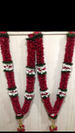 A pair of Bride and Groom Flowers Garlands