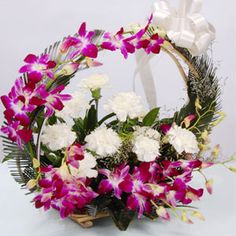 6 Purple Orchids on handle and 6 White Carnations in Basket