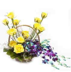 4 Blue Orchids 12 Yellow roses in Basket