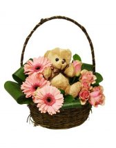 Teddy bear (6 inches) with 8 short stems of pink gerberas and pink roses in the same Basket 