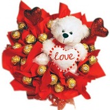 16 Ferrero chocolates in a bouquet with 12 inches Teddy